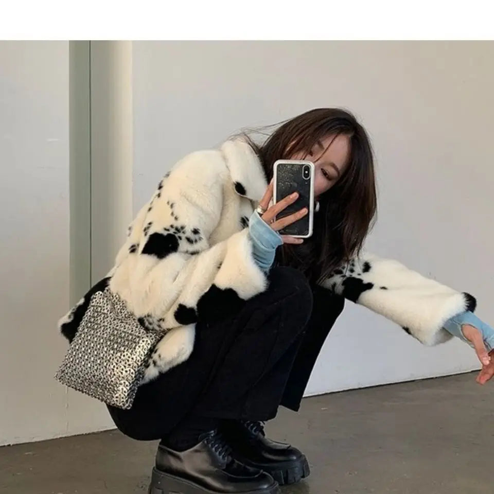 The Mirage Jacket | Black & White Cow Print Faux Fur Jacket